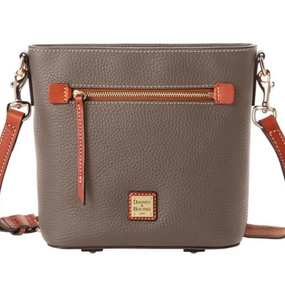 New. Never used. Never open. Dooney and Bourk 
Zip Crossbody Elephant Grey
